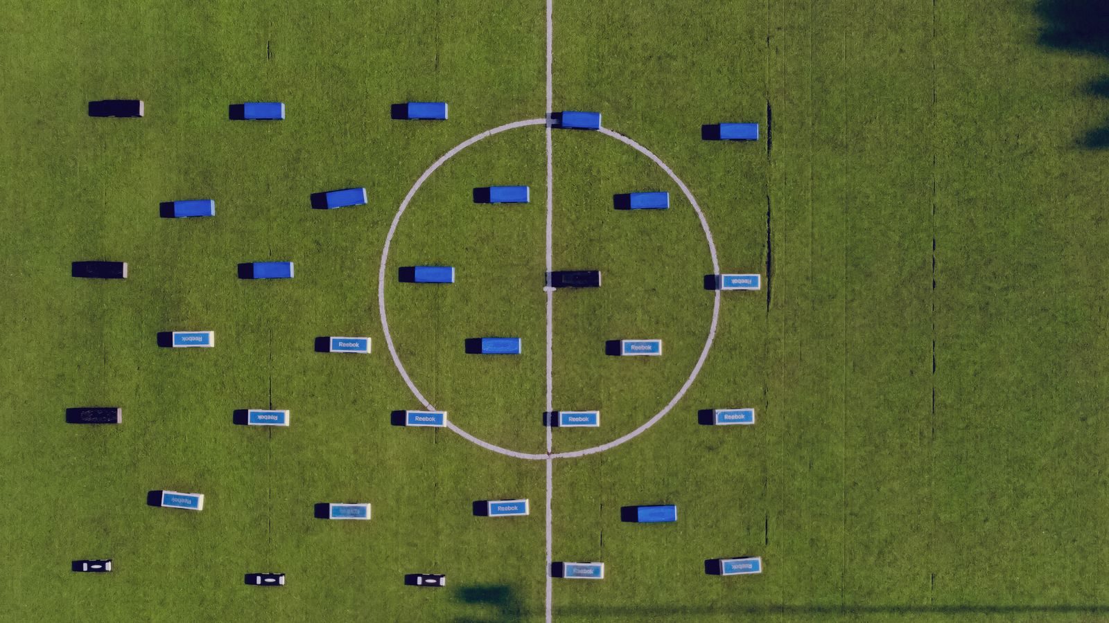 Top-down view of football field setup with benches. Abuja, Nigeria.