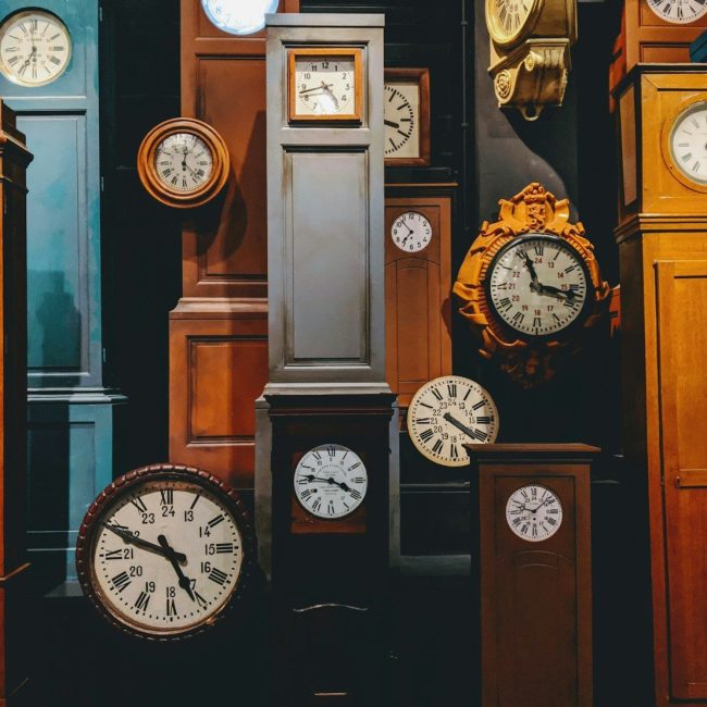 brown wooden framed analog clock